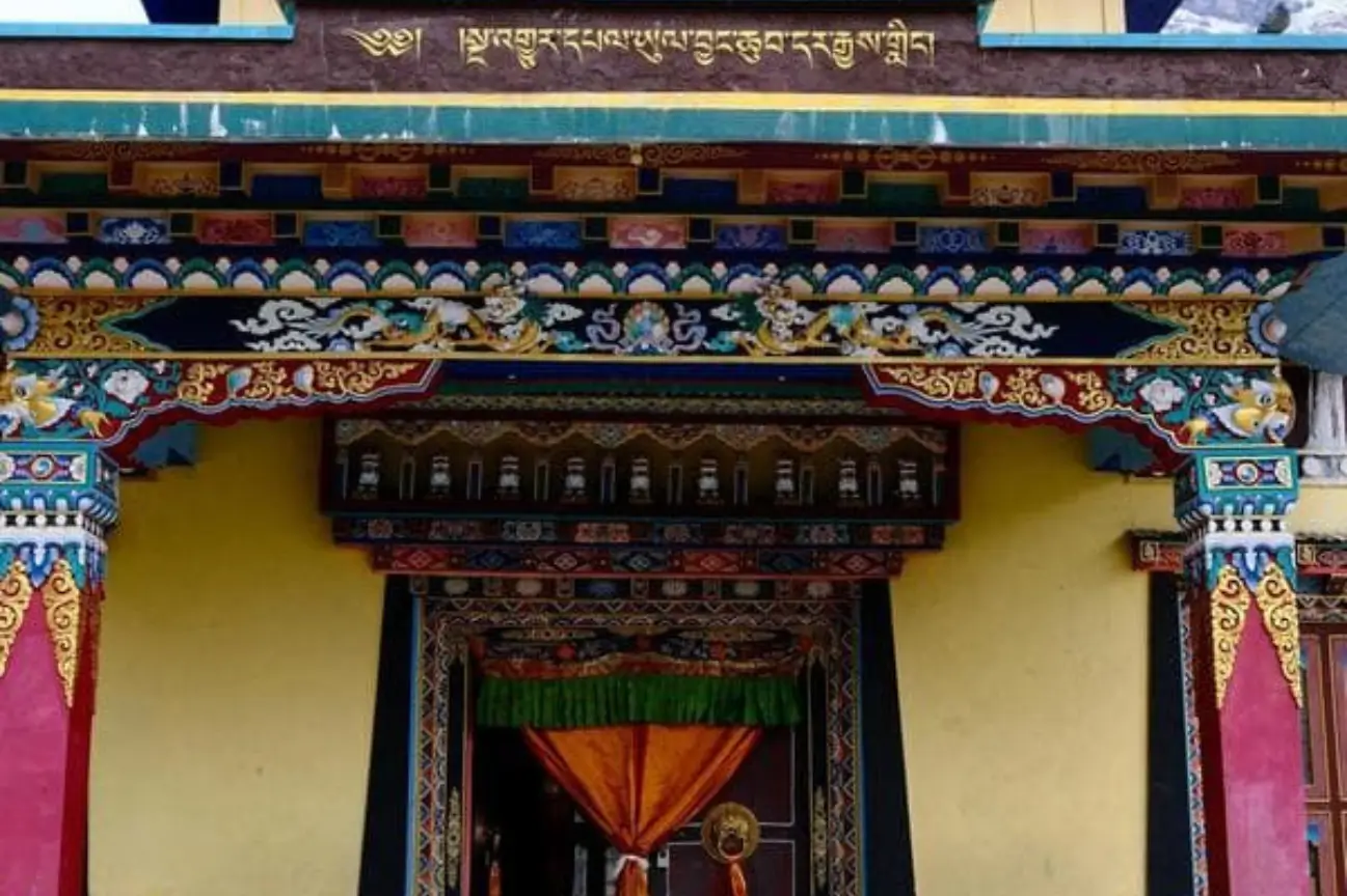 Ornate traditional architecture and vibrant carvings of a Himalayan monastery on the Annapurna Circuit Trek Tour.